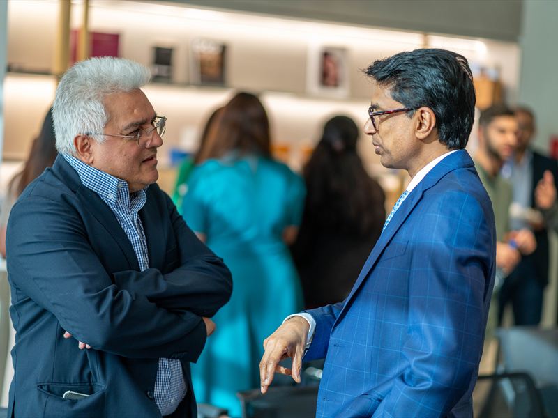 Delegates in conversation after the panel.